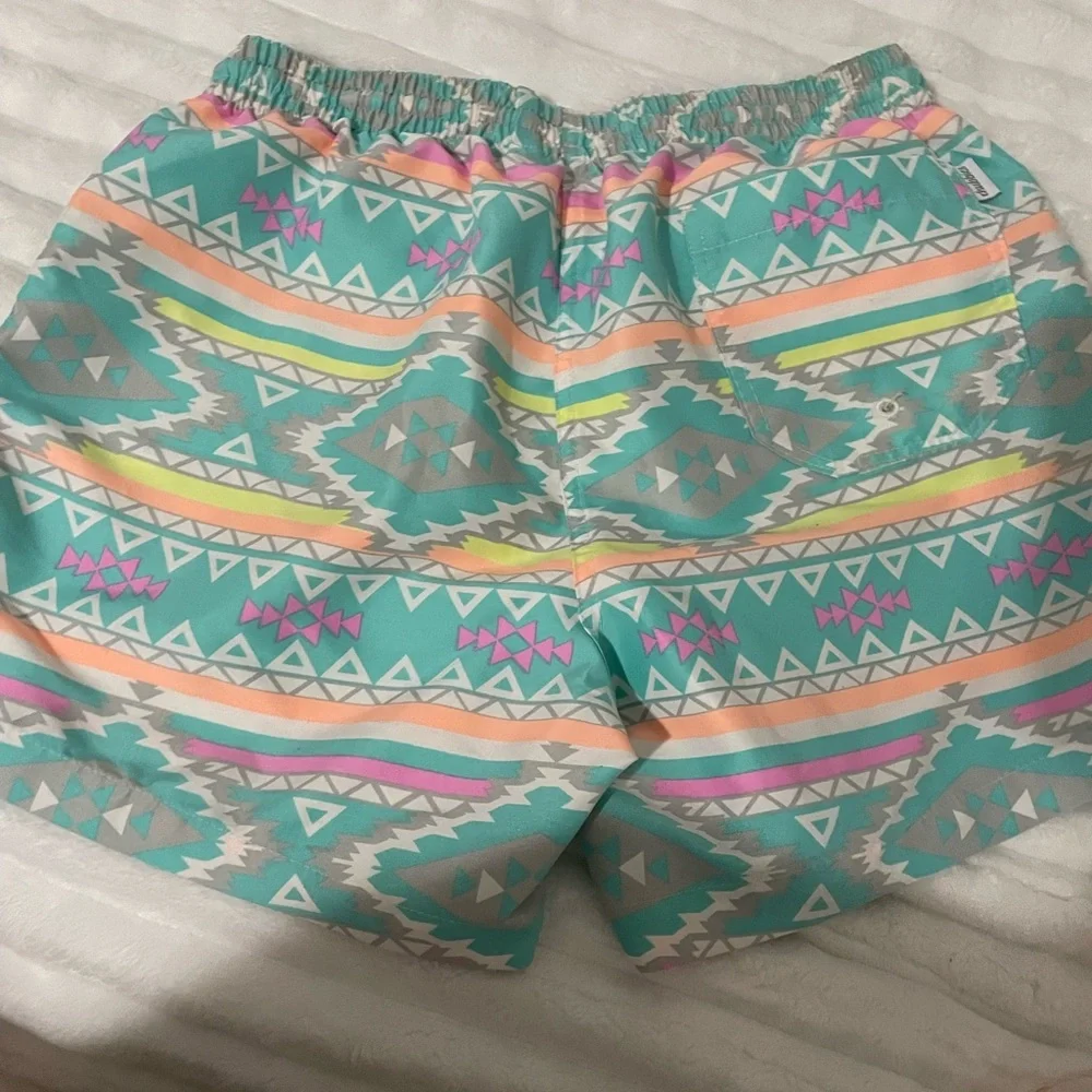 chubbies Turquoise Aztec Swim Trunks with Pink and Yellow Accents